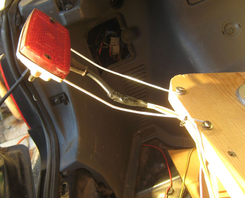 Illustration for article titled Make Your Own Animatronic Screaming Skull Brake Lights With Junkyard Parts!